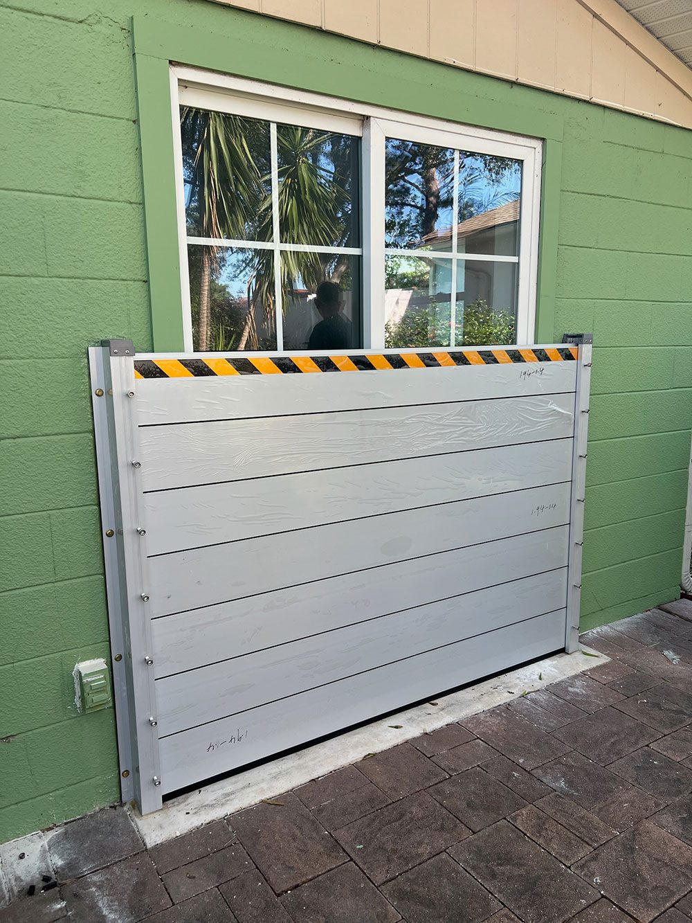 HydroDam flood barrier protecting a home entry door in Pinellas County